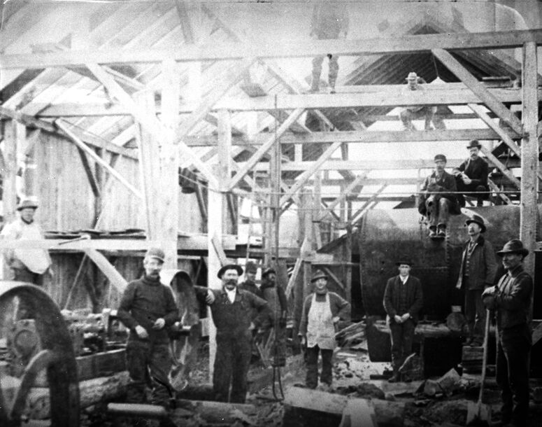 Crews man the hoist room at the Minnie Moore Mine in 1902
